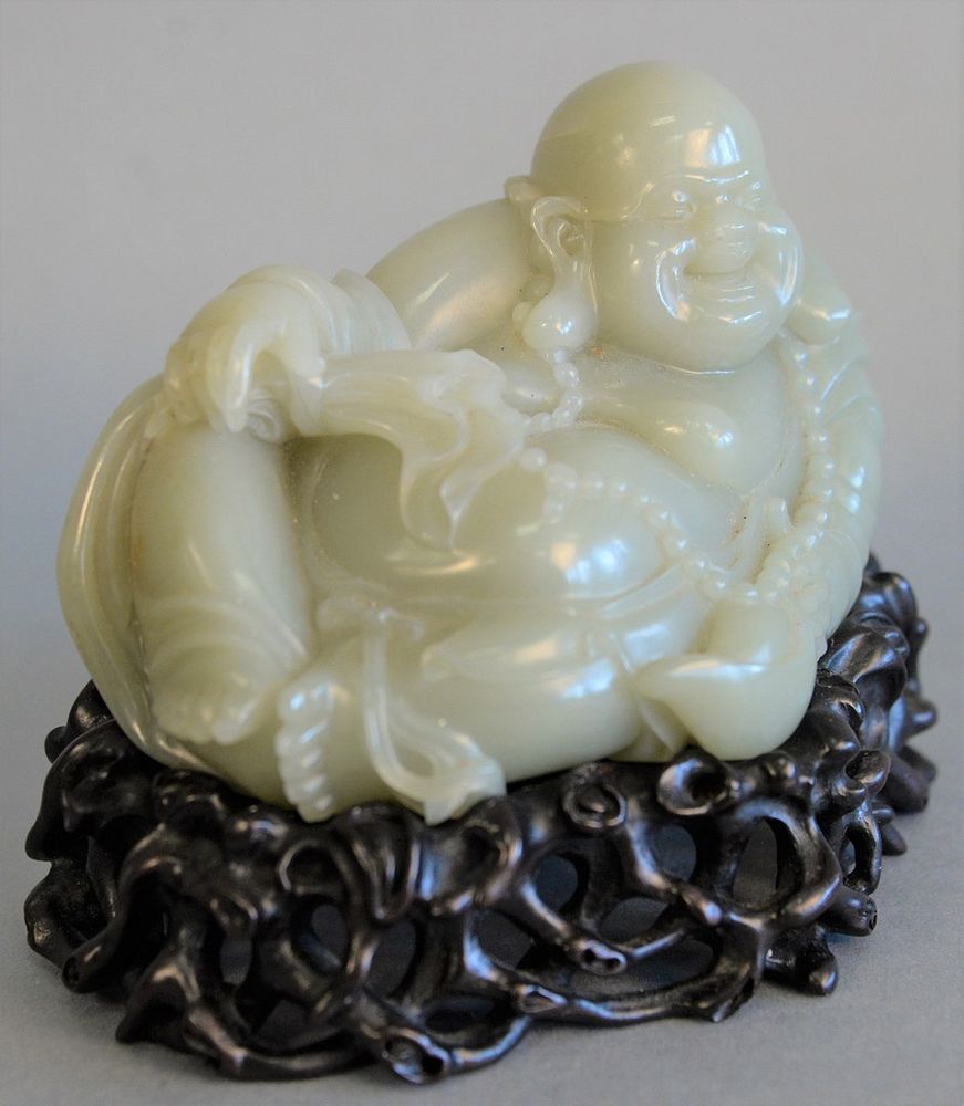 Appraisal: Celadon jade carved figure of a Buddha on carved base