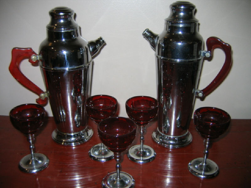 Appraisal: CHROME AND RED GLASS BAR SET Comprising five chrome stemmed