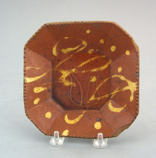 Appraisal: Redware octagonal plate th c with yellow slip decoration and