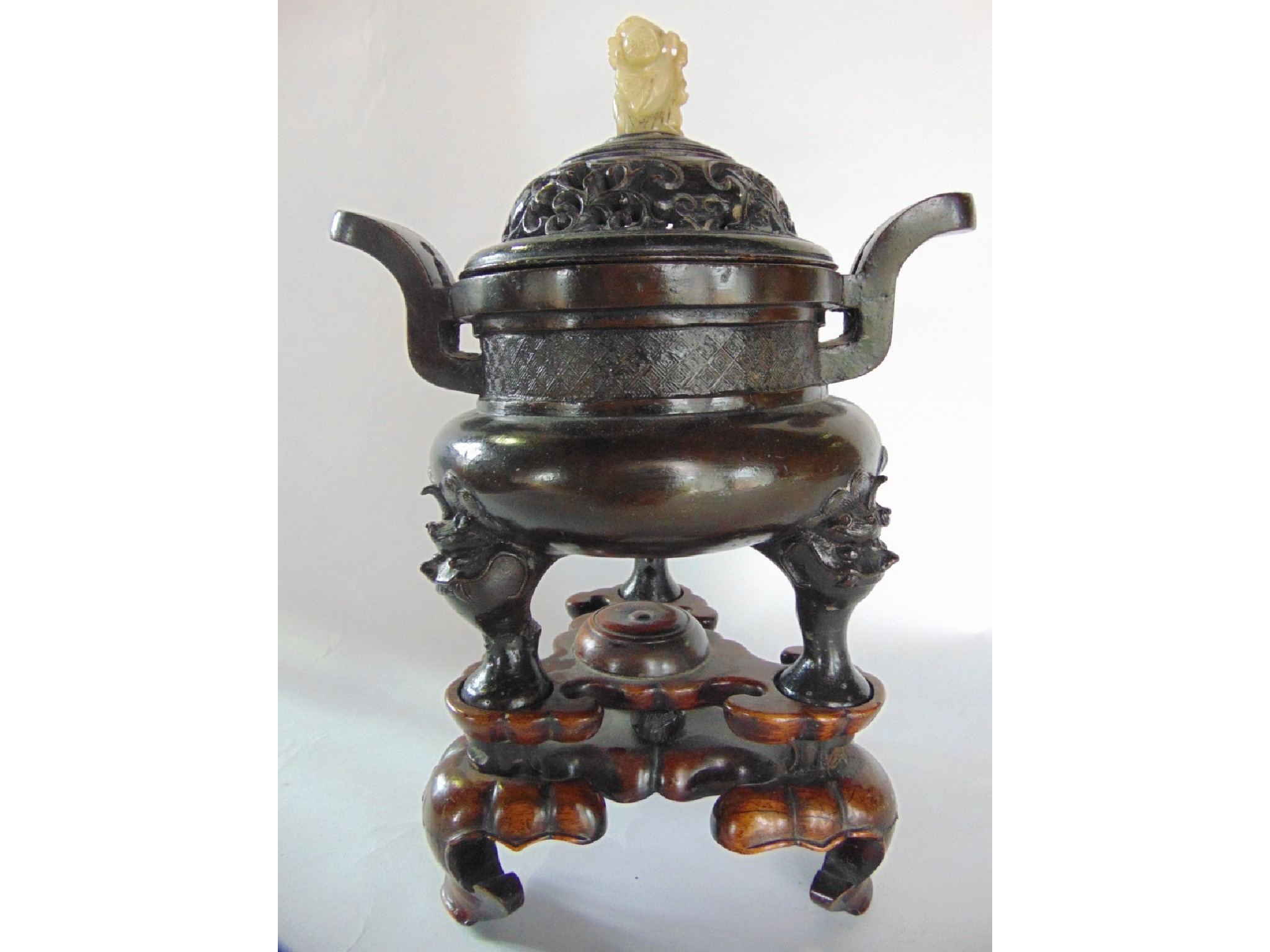 Appraisal: A Japanese bronze Koro of circular form raised on supports