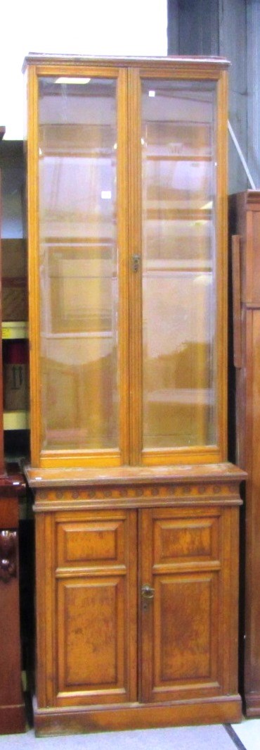 Appraisal: A Victorian oak display cabinet cupboard with pair of glazed