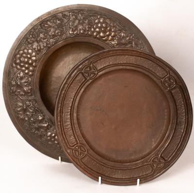 Appraisal: A copper charger with hammered centre and embossed border of