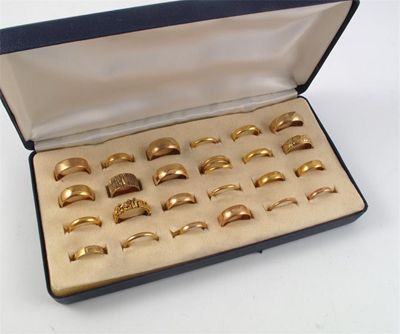 Appraisal: A box containing twenty six assorted gold rings g in