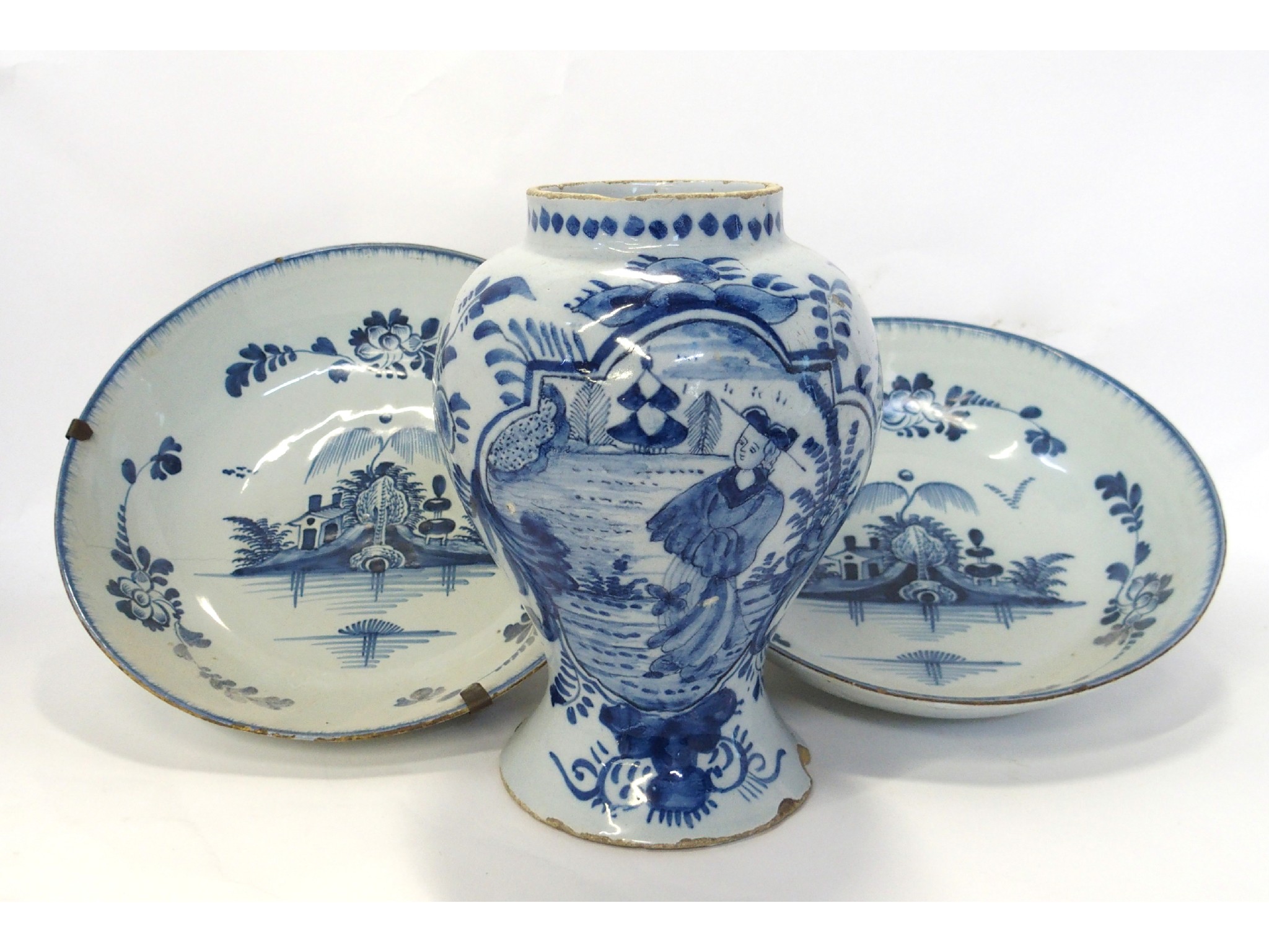 Appraisal: Pair of Delft dishes and a Dutch Delft jar