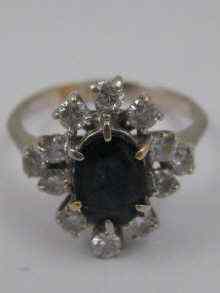 Appraisal: A yellow metal tests carat gold sapphire and diamond cluster