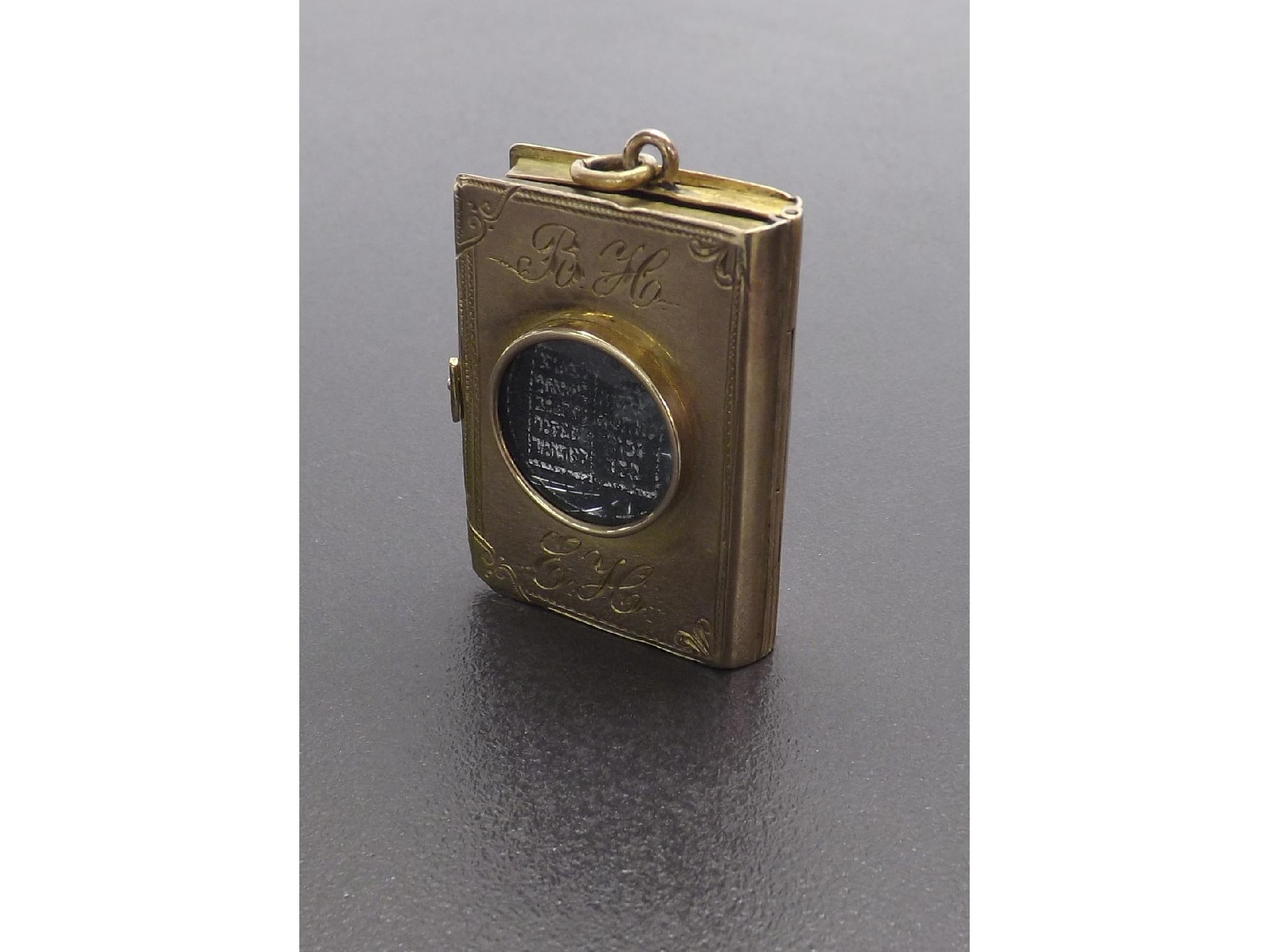 Appraisal: Judaica miniature gold cased prayer book pendant the engraved binding