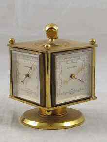 Appraisal: A Swiss four faced gilt brass Favre-Leuba clock barometer hygrometer