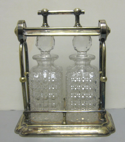 Appraisal: ENGLISH PLATED SILVER TWO-BOTTLE TANTALUS An open frame with Grinsell