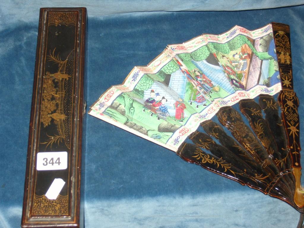 Appraisal: A th century Chinese lacquered fan with gilt decoration and