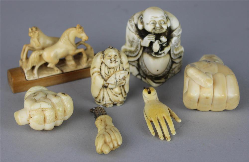 Appraisal: FOUR IVORY CARVED HANDS TH C including an amulet with