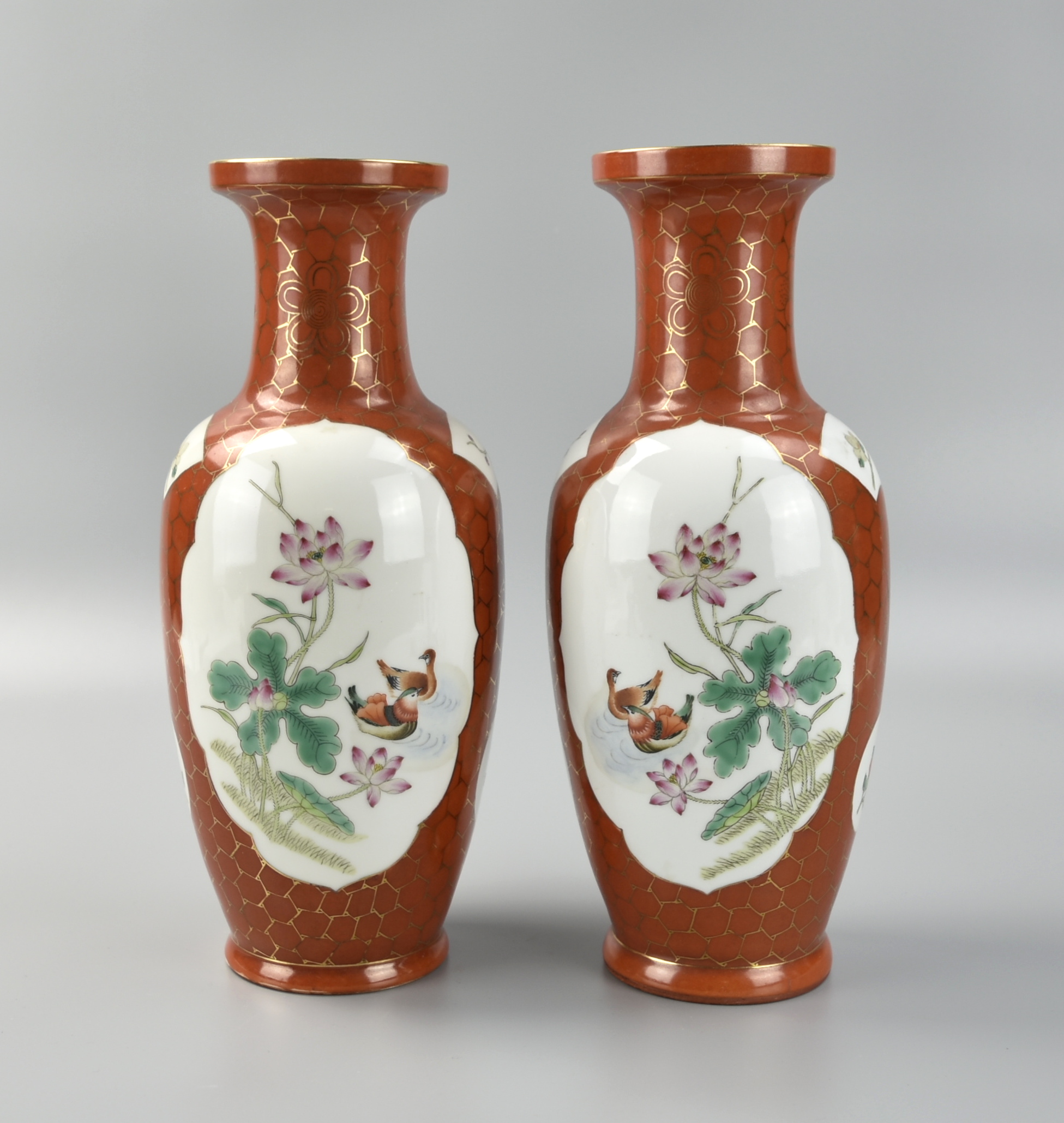 Appraisal: A PAIR OF CHINESE FAMILLE ROSE IRON RED VASE A