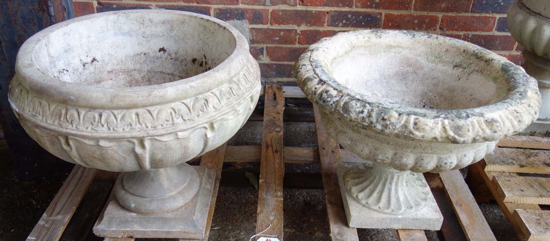 Appraisal: A composite stone planter with leaf moulded body on a