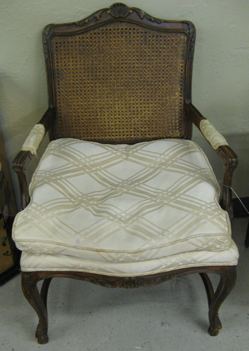 Appraisal: LOUIS XV STYLE CANED-BACK ARMCHAIR John Bruener Co with carved