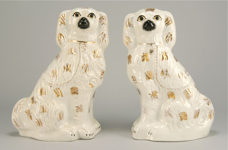 Appraisal: PAIR OF STAFFORDSHIRE SPANIELS English th CenturyWith gilt decoration Height