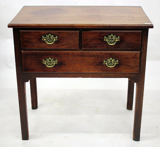 Appraisal: A GEORGE III MAHOGANY SIDE TABLE with two short and