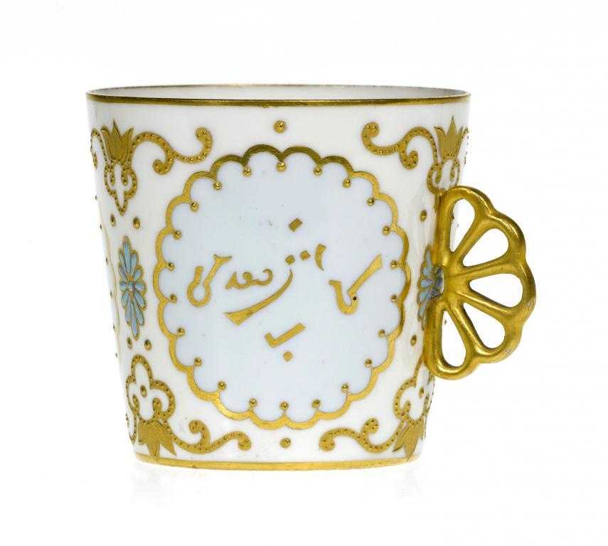 Appraisal: A CROWN DERBY EGGSHELL BODY COFFEE CUP with reticulated gilt