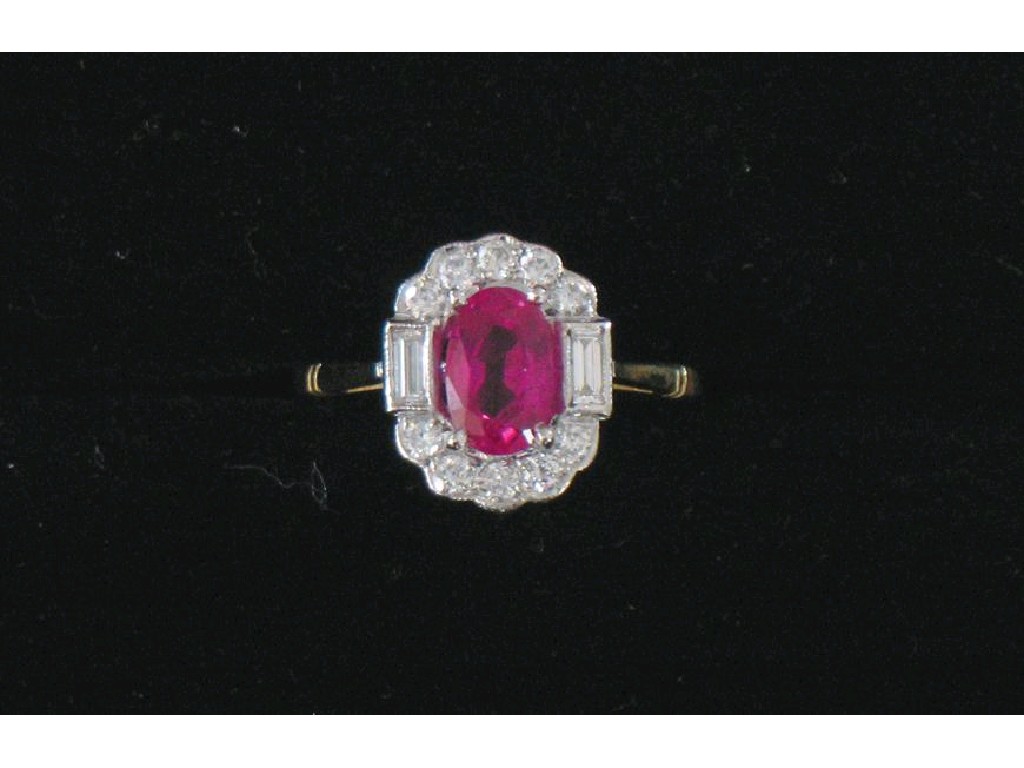 Appraisal: A RUBY AND DIAMOND CLUSTER DRESS RING the central oval