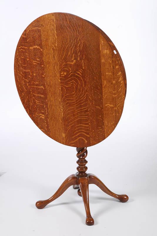 Appraisal: TILT TOP LAMP TABLE In oak Round top and beaded