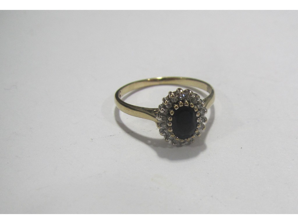 Appraisal: Gold sapphire and diamond cluster ring Ring size S