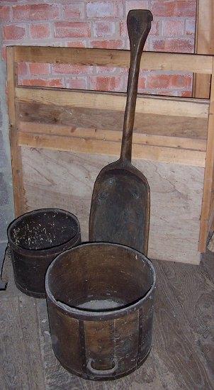 Appraisal: A wooden corn shovel and two twin-handled grain measures