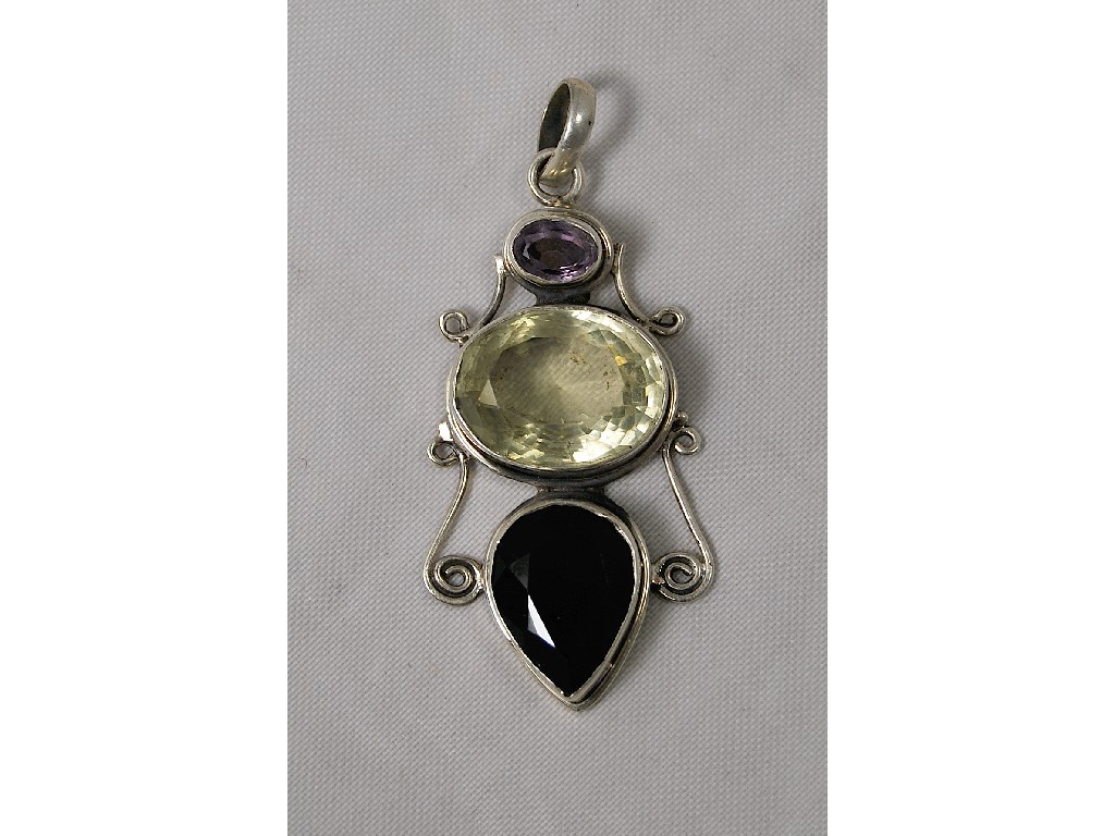 Appraisal: Large amethyst and citrine set pendant white metal scrollwork setting