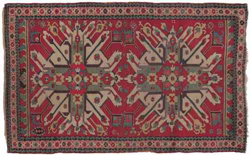 Appraisal: Eagle Kazak throw rug with a red field and multiple