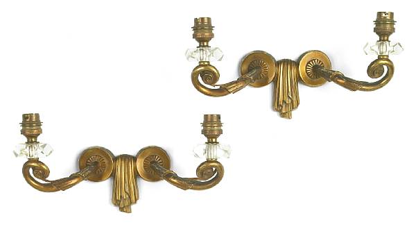 Appraisal: A pair of Jules Leleu patinated gilt-bronze two-light sconces s