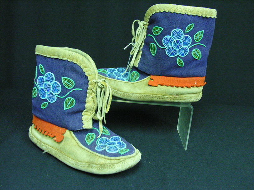 Appraisal: NATIVE AMERICAN WOOL AND LEATHER BOOTS Floral beadwork on wool