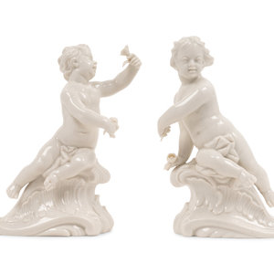 Appraisal: A Pair of Nymphenburg Porcelain Cherubs th Century each bearing