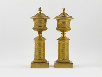 Appraisal: A pair of French gilt brass cassolettes with pierced reversable