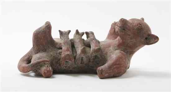 Appraisal: A Colima Style Pottery Figural Group depicting a recumbent dog