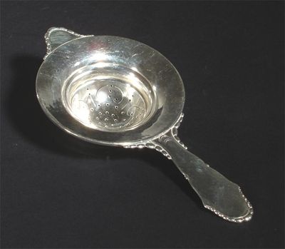 Appraisal: A Georg Jensen silver tea strainer stamped marks cm long