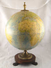 Appraisal: A terrestrial globe on vertical axis with hardwood circular base