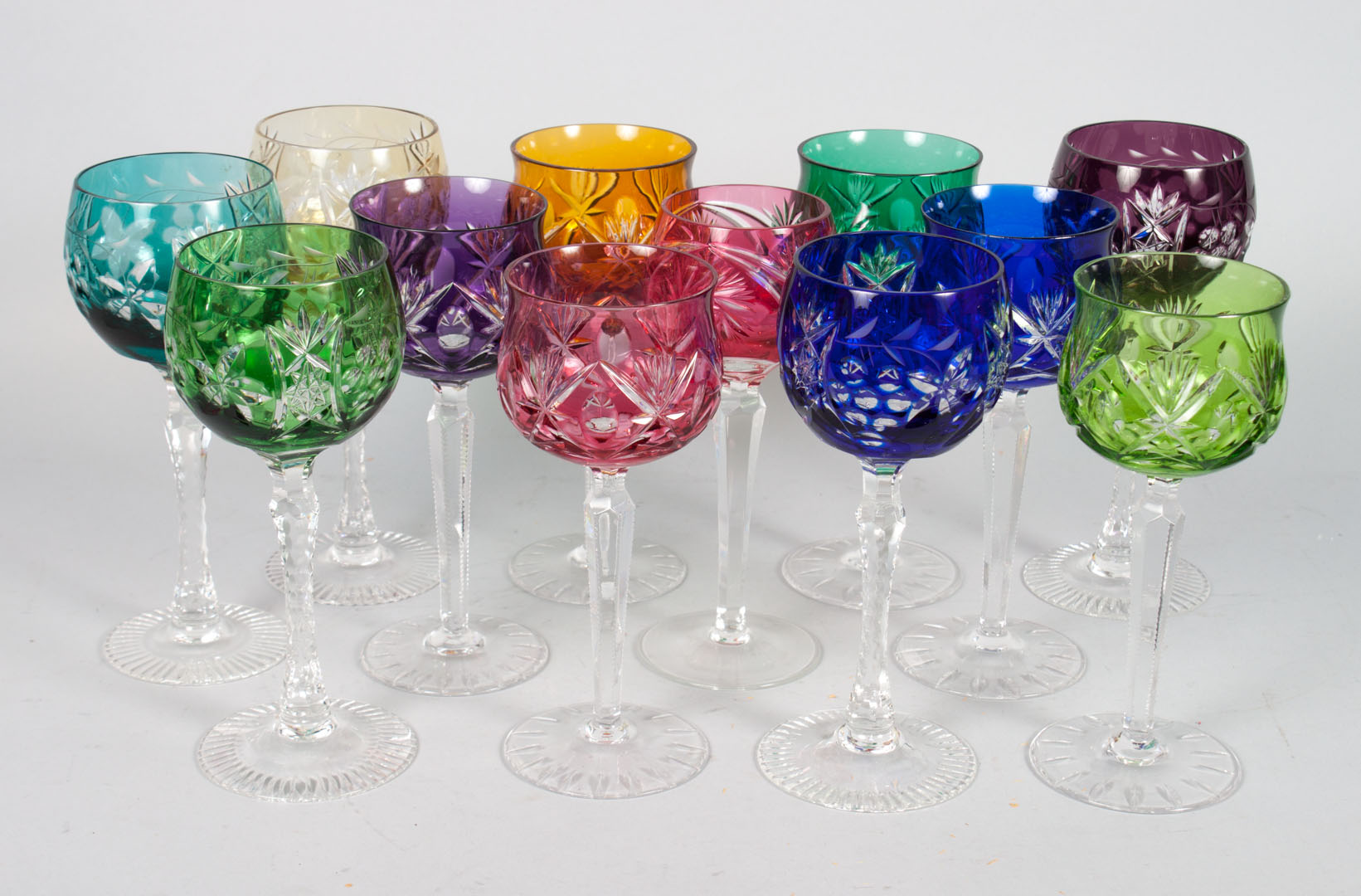 Appraisal: Czecho-Bohemian color cut-to-clear stems each stemware with star and geometric