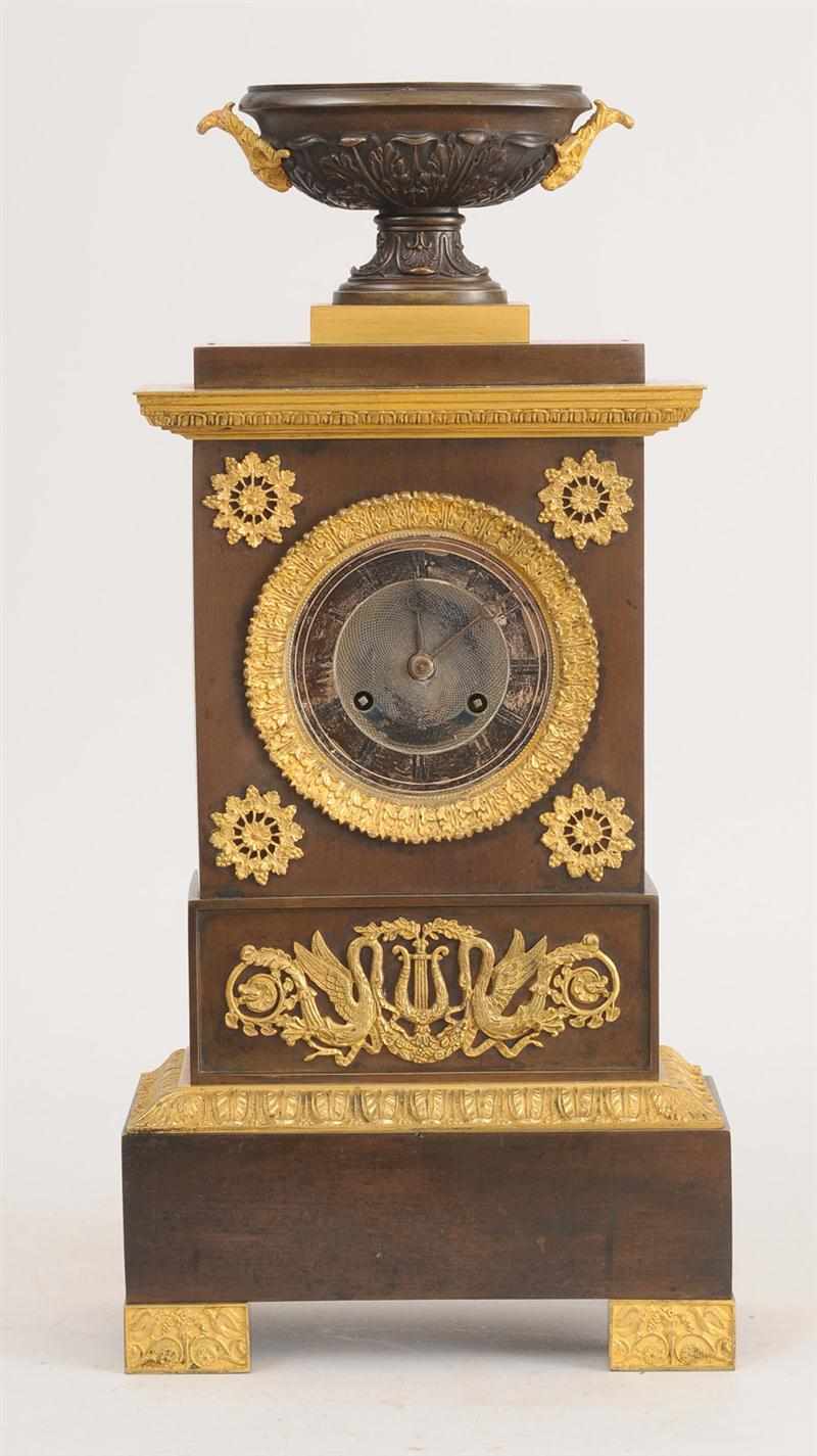 Appraisal: CHARLES X PATINATED AND GILT-BRONZE MANTEL CLOCK The silvered dial