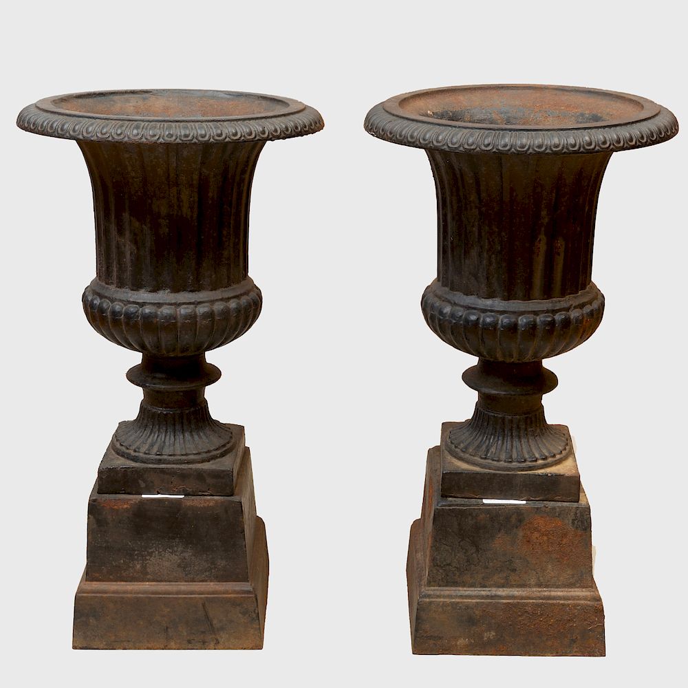 Appraisal: Pair of Black Painted Cast Iron Garden Urns on Bases