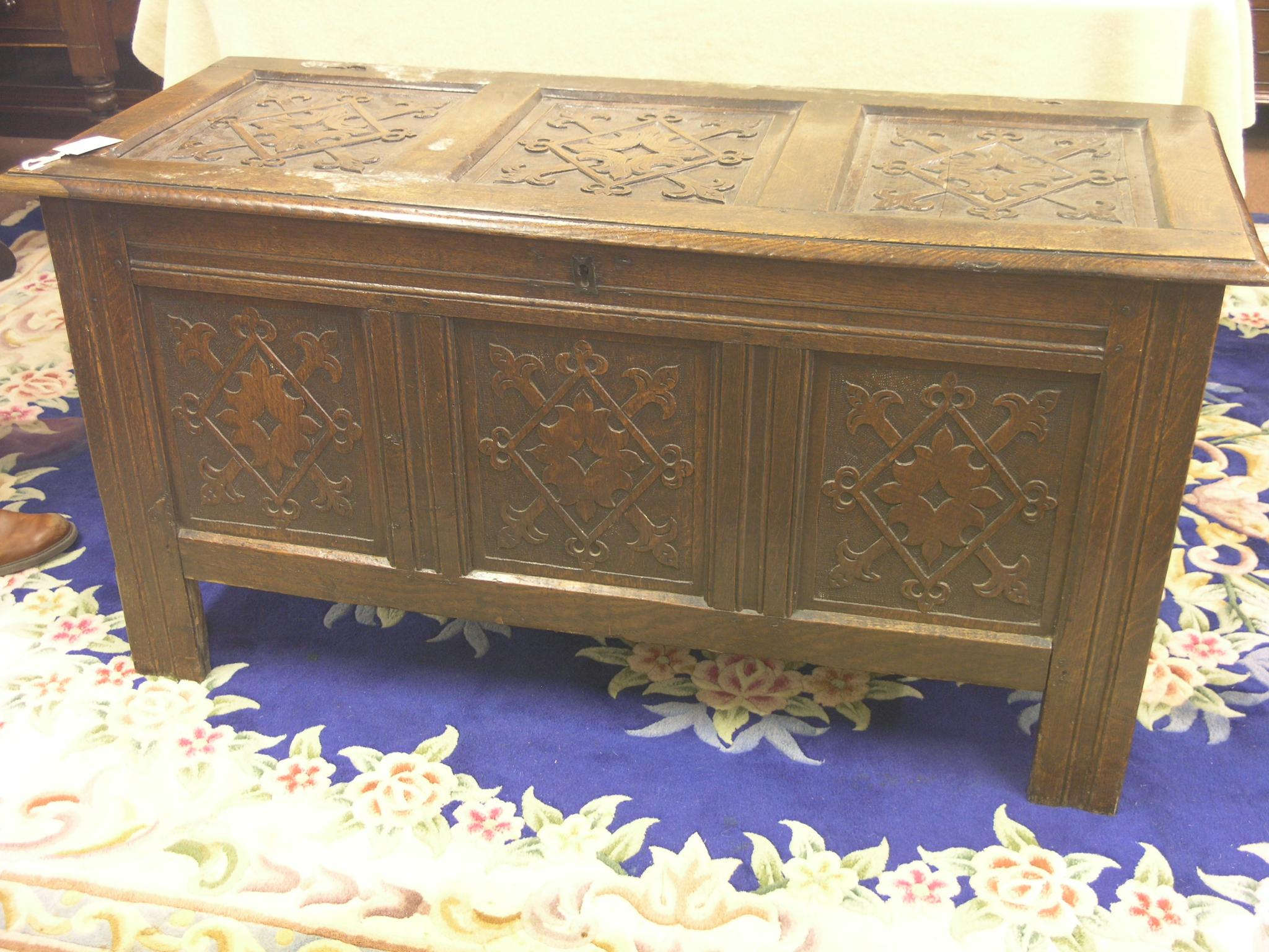 Appraisal: A th century panelled oak coffer carved with lozenges and