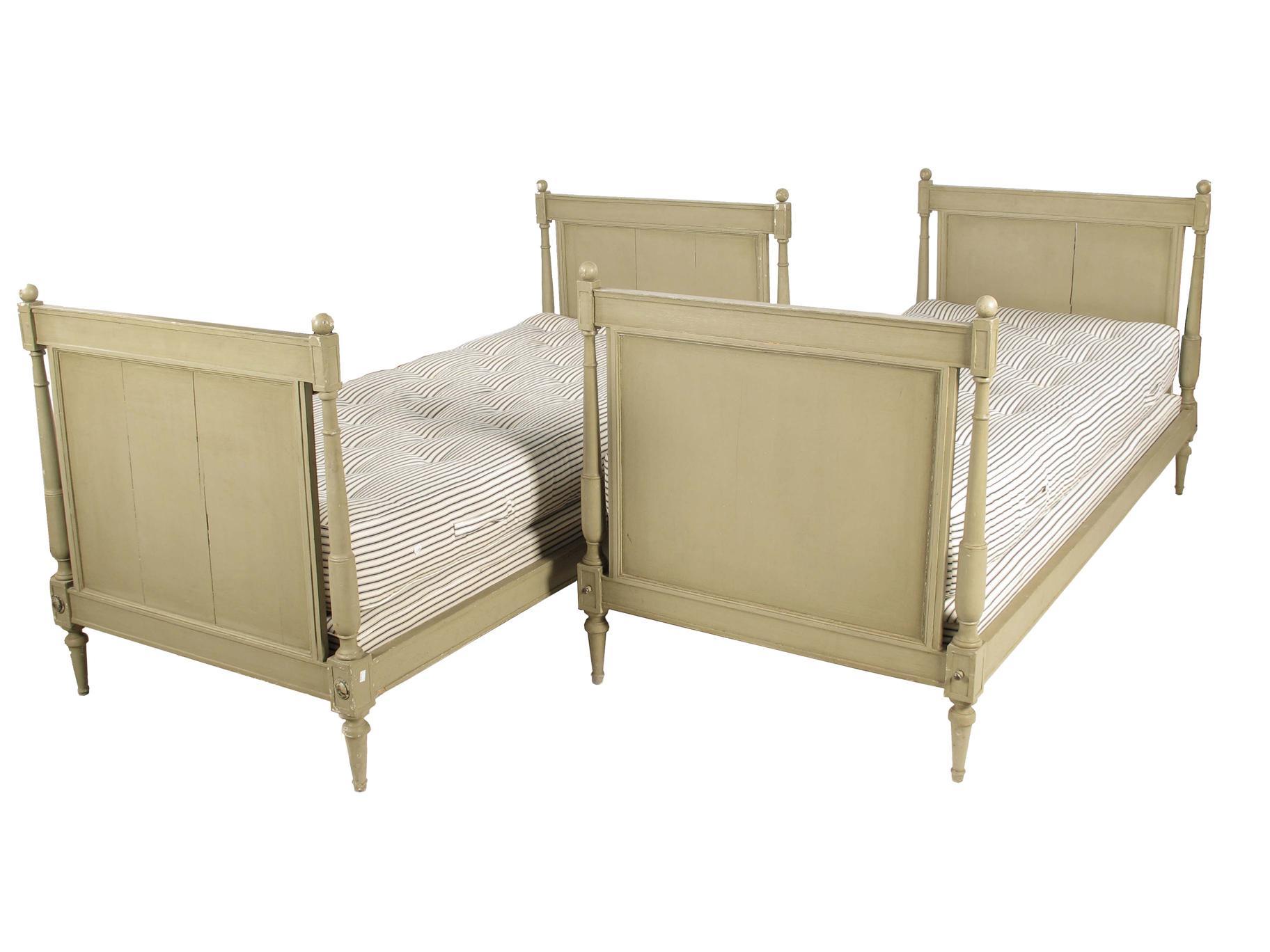 Appraisal: A pair of painted pine single beds