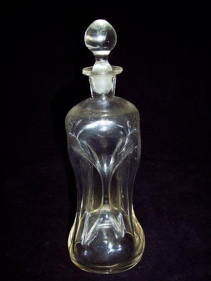 Appraisal: A small hour glass shaped decanter with stopper cm high