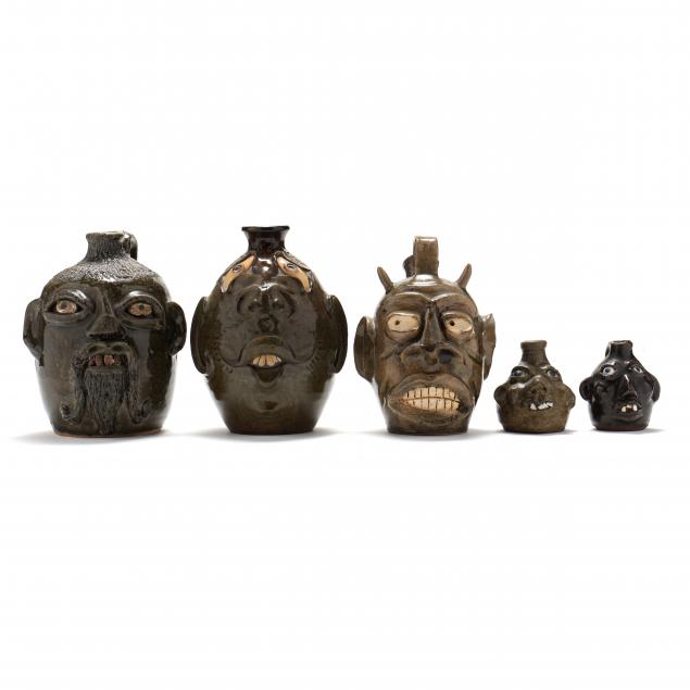 Appraisal: FIVE SOUTHERN FOLK POTTERY FACE JUGS Four are alkaline glazed