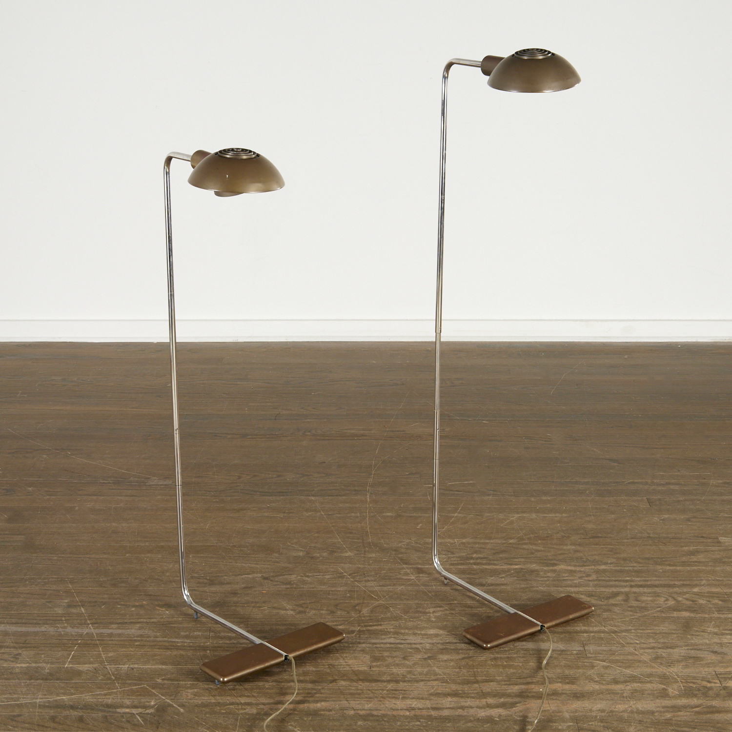 Appraisal: CEDRIC HARTMAN PAIR BRONZE CO FLOOR LAMPS c American architectural