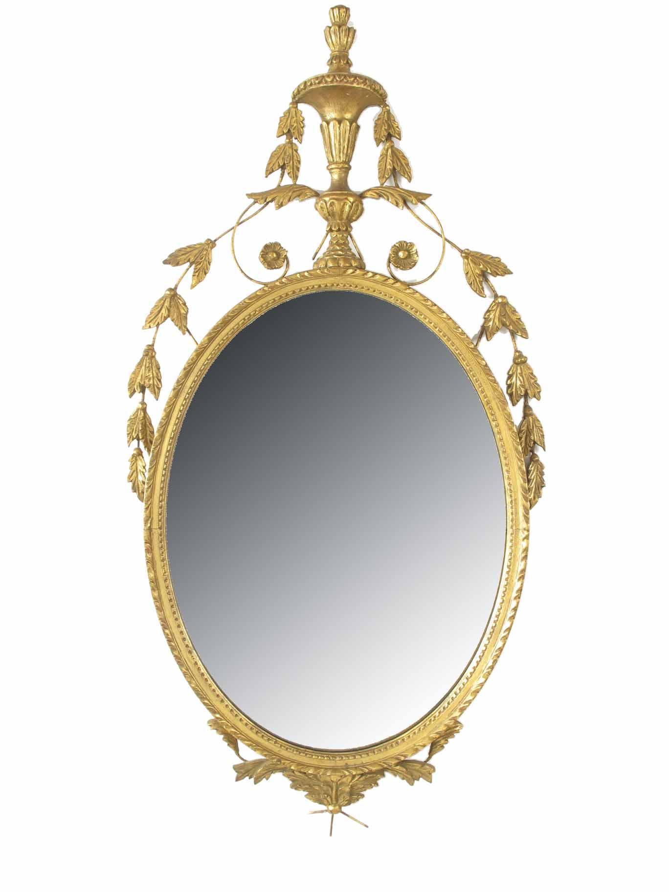 Appraisal: An Italian giltwood and gesso oval wall mirror