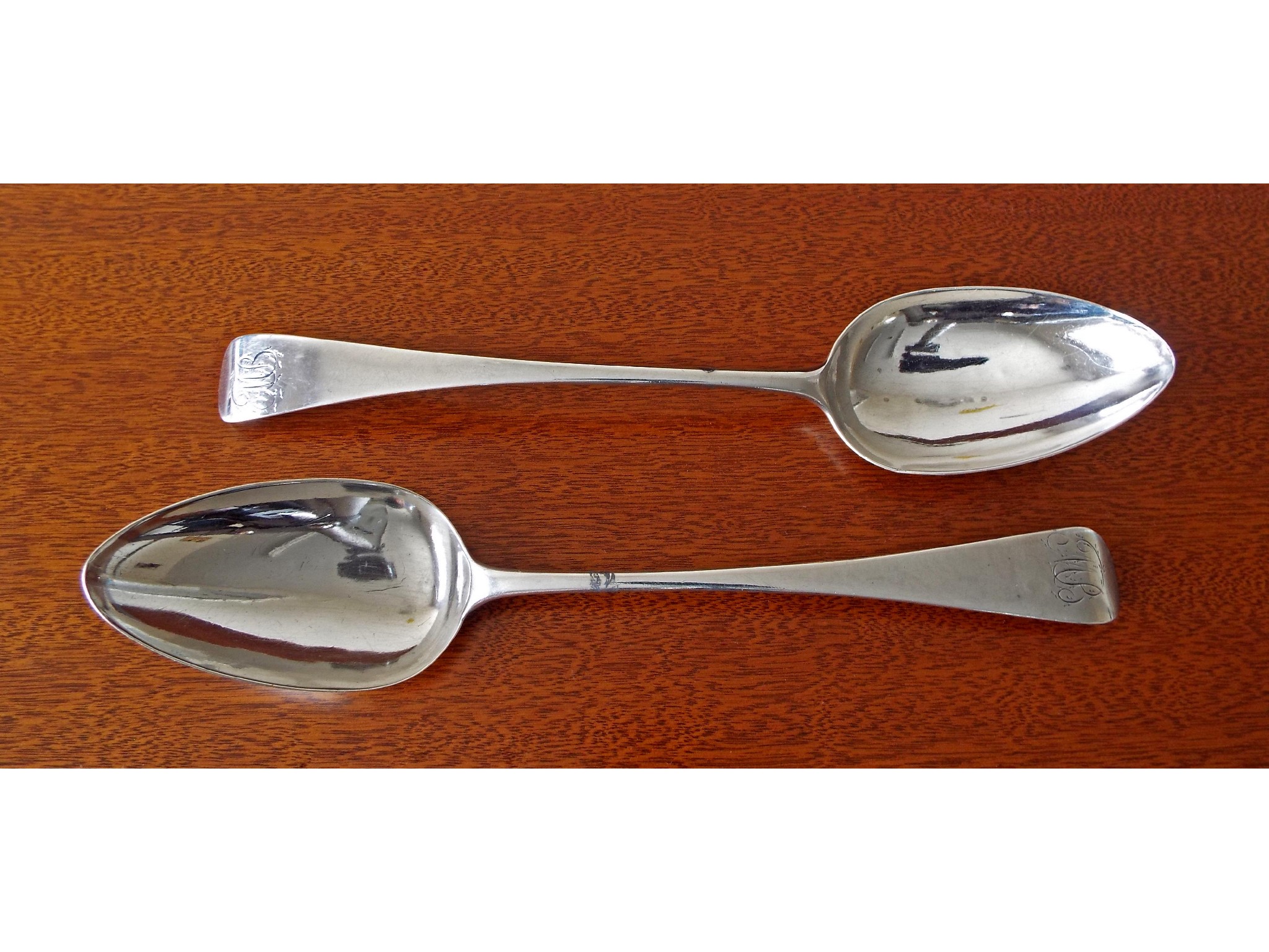 Appraisal: Pair of George III silver fiddle pattern serving spoons maker