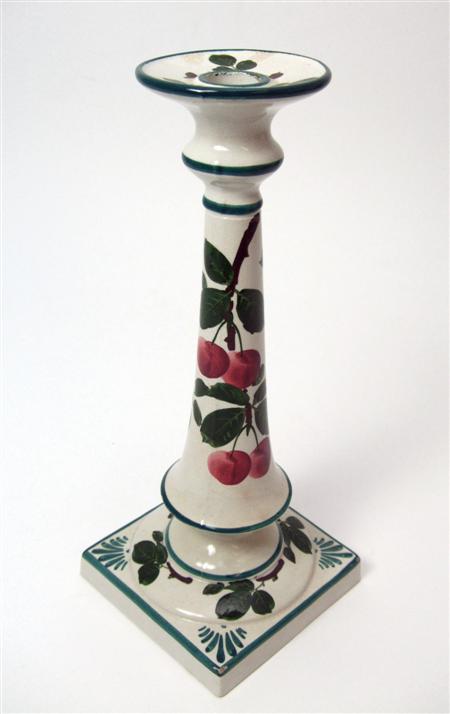 Appraisal: WEMYSS TALL SQUARE-BASE CANDLESTICK CIRCA decorated with cherries impressed mark