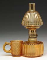 Appraisal: RARE MATCH HOLDER LAMP S - Amber glass with embossed