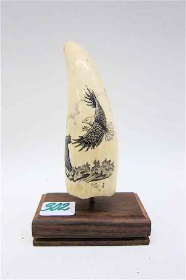 Appraisal: IVORY WHALE'S TOOTH scrimshawed with an American bald eagle in