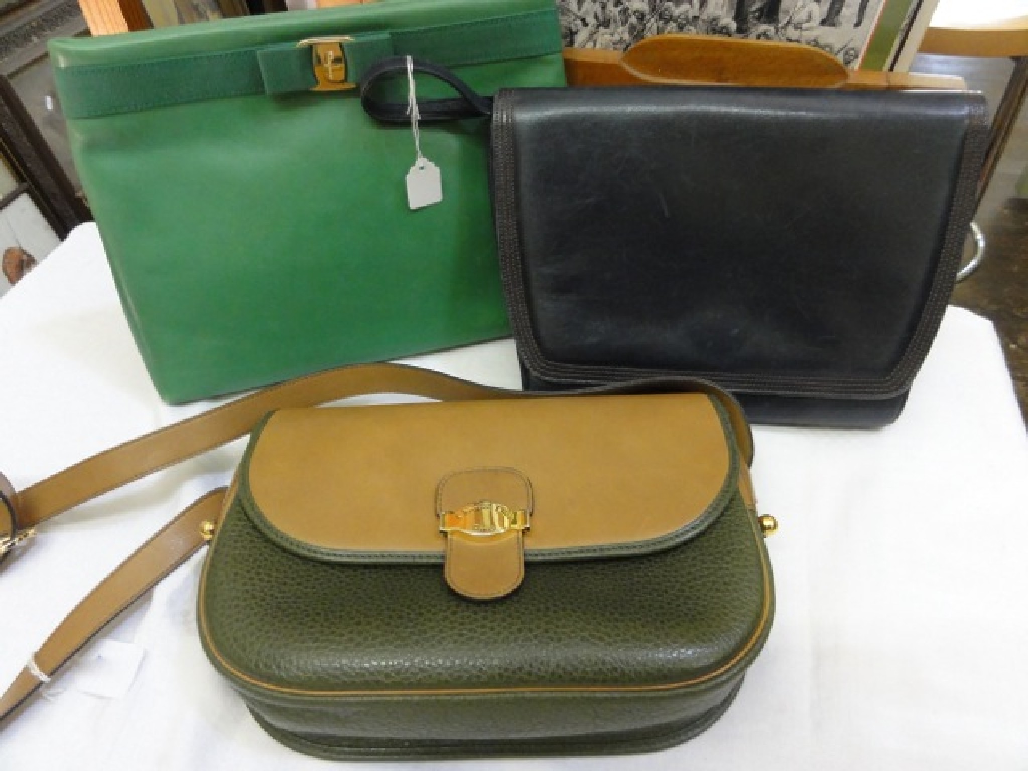 Appraisal: A Christian Dior shoulder bag in green and buff coloured