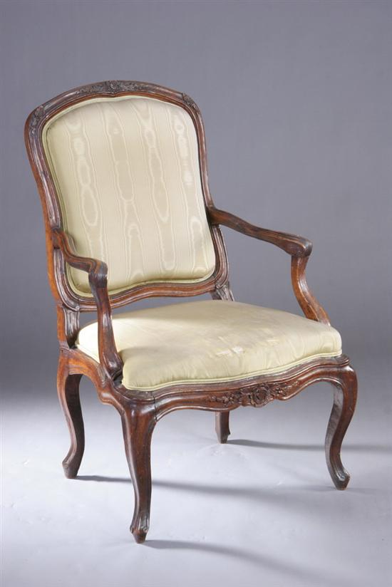 Appraisal: LOUIS XV STYLE PROVINCIAL FRUITWOOD FAUTEUIL th century moire upholstery