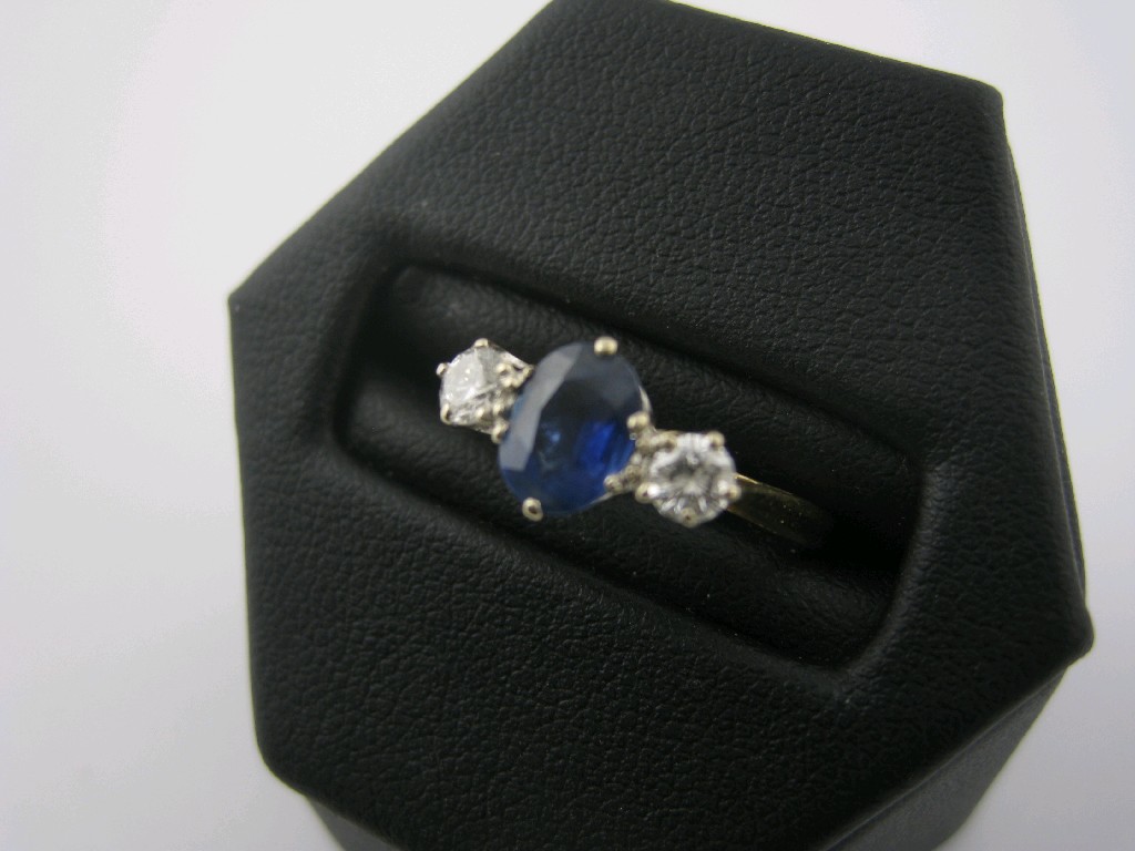 Appraisal: A Sapphire and Diamond three stone Ring claw-set central oval-cut