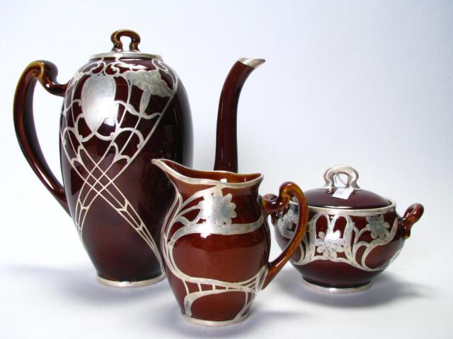 Appraisal: Lenox porcelain tea set with brown glaze and sterling overlay